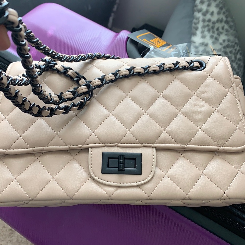 Nude and black hand bag